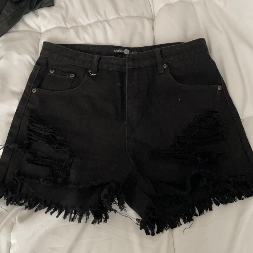 Distressed black jean shorts